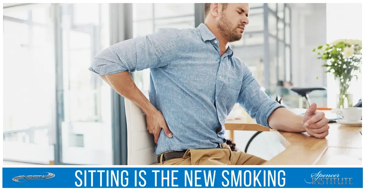 man sitting at desk with back pain
